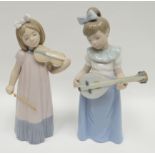 Two Nao standing musical instrument playing figures