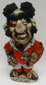 A rare John Hughes 'Grogg' stoneware standing Welsh jersey rugby-player to commemorate the 'WRU