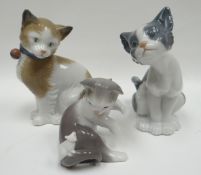 Two Lladro cat models and a similar Nao