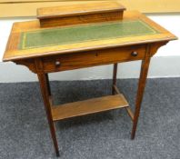 An inlaid rosewood Edwardian ladies writing desk with raised stationery compartment to the rear with