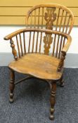 A small nineteenth century Windsor elbow chair with spindle to hoop arrangement to the back and