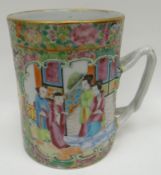 A nineteenth century Canton famille-rose Chinese mug, typically decorated and with three panels