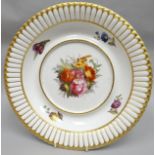 A nineteenth century Derby porcelain tureen stand of circular form and finley painted with a large