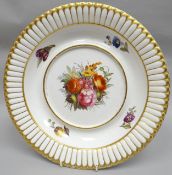 A nineteenth century Derby porcelain tureen stand of circular form and finley painted with a large