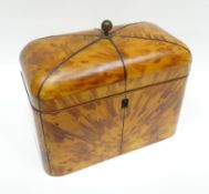 A Regency blonde tortoise-shell loaf-shaped tea-caddy with pewter stringing and an interior fitted