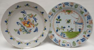 Two eighteenth century polychrome delft chargers, one with a spray of flowers to the interior and