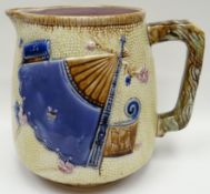 A Staffordshire majolica jug decorated in the Chinese taste with fan, 8ins high (20cms)