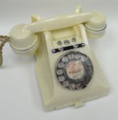 A mid-twentieth century ivory coloured finger-dial telephone with memo-slide, No.328CB