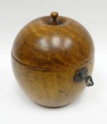 A reproduction wood-turned fruit-form tea-caddy with hinged lid and silvered interior, 5ins high (