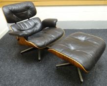 A mid to late twentieth century Charles and Ray Eames buttoned black leather chair and matching