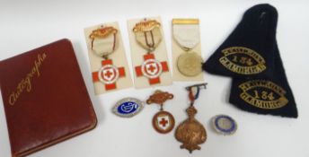 An interesting parcel of Great War period boxed British Red Cross enamelled badges and Red Cross War