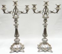 A pair of Continental (possibly Dutch) silver three branch candelabra with removable branches to