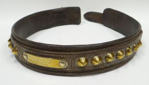 An intriguing, believed nineteenth century, leather dog-collar having two rows of brass studs
