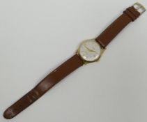 A 9ct yellow gold encased gent's Avia wrist watch on tan leather strap