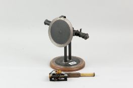 A vintage monocular scope on stand with multi-swivel action and pointers (possibly for calibrating