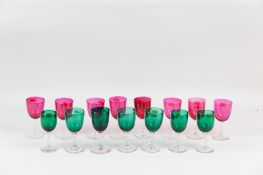 Seven late 19th Century drinking glasses with green glass bowls and clear stems along with eight