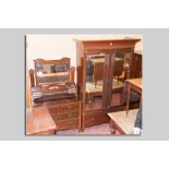 An Edwardian red walnut two piece bedroom suite comprising a double door mirrored wardrobe with