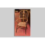 An elm Windsor splat and spindlebacked elbow chair with turned supports and centre stretcher