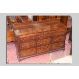 A late 18th/early 19th Century oak and mahogany crossbanded Lancashire chest having a narrow