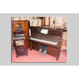 An early 20th Century upright pianola piano manufactured by the Aeolian Company Ltd, London along