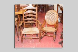 An Edwardian mahogany cane backed and cane seated simple rocking chair and an elm rush seated