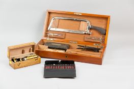 A mahogany cased part field surgeon's kit including bone saw, a Victorian lidded box with