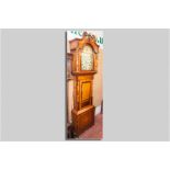 A Victorian oak and mahogany longcase clock with 14 ins painted arched top dial, Roman numerals with