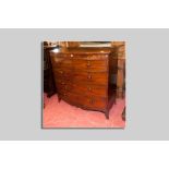 An early Victorian mahogany bow front chest of three long and two short drawers all with turned