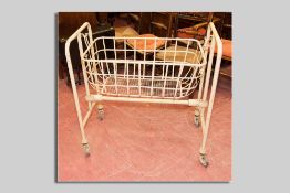 A cast iron and wirework maternity crib, early to mid 1900s, 95 x 85 cms approximately