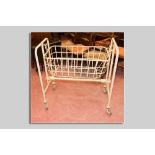 A cast iron and wirework maternity crib, early to mid 1900s, 95 x 85 cms approximately