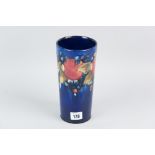 A Moorcroft slender chimney vase of tapering form, all over cobalt blue ground having tube lined