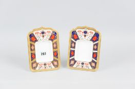 A pair of Royal Crown Derby Imari patterned easel portrait frames, numbered 1128 to the base, 19 cms