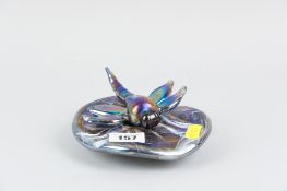 A Lazlo iridescent glass lily pad paperweight, the top with applied iridescent glass dragonfly,