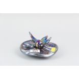 A Lazlo iridescent glass lily pad paperweight, the top with applied iridescent glass dragonfly,