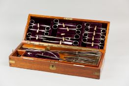 A 19th Century mahogany cased surgeon's set by S Mawson & Sons, a well fitted velvet and mahogany