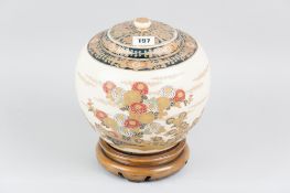 A 19th Century Japanese Satsuma baluster jar with stylised floral decoration, knopped cover and