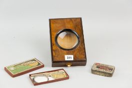 A walnut and ebonised photo magnifier, a boxed vintage pistol flash meter and a Tam o'Shanter