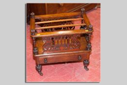 A Victorian walnut and string inlaid triple section Canterbury with fretwork side, front and rear