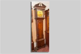 A late 18th Century Irish mahogany longcase clock, the hood with broken architectural pediment and