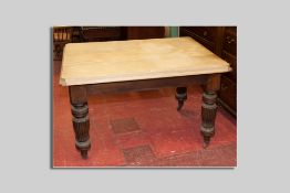 An early 19th Century scratch top kitchen table with single end drawer on bulbous turned and