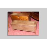 A long wooden carpenter's chest with interior box end drawer, 109 cms wide and another narrow