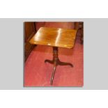 A Victorian mahogany tilt top tripod table, the near square top over a turned centre pedestal and