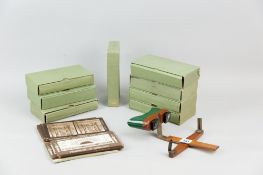 A wood and metal Sunbeam stereoscope with sun guard along with a boxed Sunbeam sunscope and seven