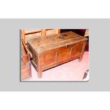 An 18th Century oak dower chest having three inset panels to the front, 130 cms wide