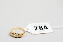 An 18ct gold five stone diamond dress ring, 4 gms