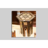 An Eastern style hexagonal topped side table with multi-wood Tunbridge type inlay, ebonized woods