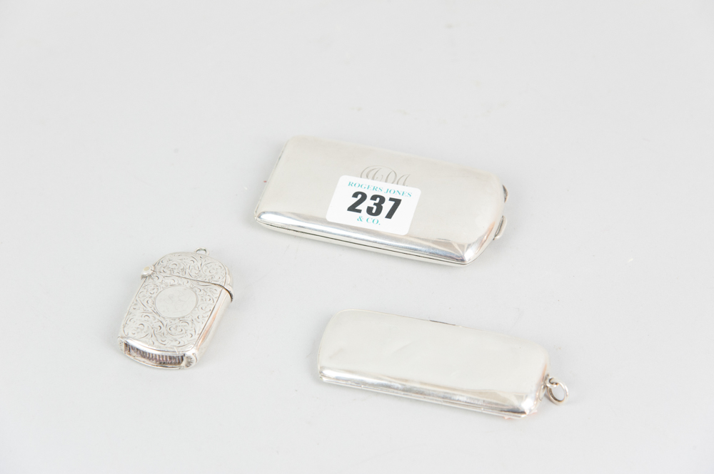 A bright cut silver vesta, 0.7ozs, a narrow plain two-cigarette case, 1oz, Birmingham 1911 and a