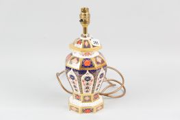 A Royal Crown Derby Imari patterned octagonal based table lamp of shaped form with a stepped