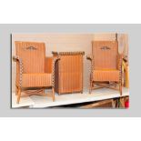 A pair of Lloyd loom orange coloured armchairs with black flashing by W Lusty & Sons and a