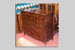 A 19th Century mahogany chest of four long graduated drawers and two small drawers, all with brass